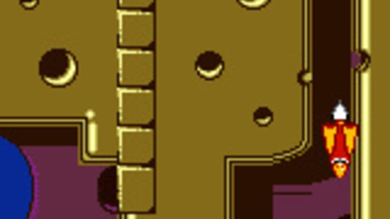A character sprite in red and yellow clothing stands on the right side of a yellow-walled interior space. Brown circular enemies with crescent-shaped faces float in the upper portion of the room. A vertical column of tan-colored boxes runs down the center-left. The walls feature dark brown trim and corners with gold-colored accents. A blue shape is partially visible on the far left edge, and purple flooring or walls appear in lower sections. The sprite palette uses limited colors typical of Game Boy hardware.