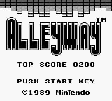 The title screen displays "ALLEYWAY" in large pixelated white block letters centered on a dark background with a grid pattern. Below the title, text reads "TOP SCORE 0200" followed by "PUSH START KEY" and a copyright notice "©1969 Nintendo" in smaller black text. The overall composition uses a monochrome palette typical of early Game Boy displays, with stark contrast between the white typography and dark background.