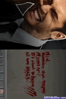 The upper half displays a close-up of a man's face with facial hair, shown in color photography against a dark background. The lower half shows a notebook or paper with red handwritten text arranged vertically in multiple lines, though the specific words are not clearly legible in this image. The contrast between the photographic element and the handwritten text suggests a visual narrative typical of detective or mystery-themed games.