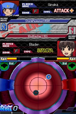 A Beyblade battle arena occupies the center of the screen, displaying a circular red and purple stadium with a crosshair target. Two player cards appear at top and bottom: Gingka with an Attack-type Beyblades StorageAssault B5F at top, and Blade with a Stamina-type Beyblades Windgasher B5S at bottom. Player names and rank information flank the cards on the left. Green circular indicators labeled 'Sp' appear on the lower left and right edges. The DS interface shows typical 2D sprite-based graphics with a dark background and red UI elements framing the battle screen.