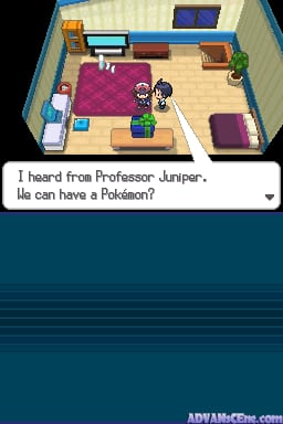 A top-down interior view displays a bedroom with cream-colored walls and wooden flooring. A pink bed occupies the left side, with a small sprite character standing nearby. Furniture includes a blue desk with a monitor in the upper left, brown shelving units, and various decorative items. A dialog box at the bottom reads 'I heard from Professor Juniper. He can have a Pokémon?' in white text on a dark background. The 3D isometric art style uses low-polygon models typical of Nintendo DS graphics.