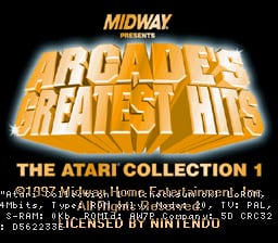 The title screen displays "ARCADE'S GREATEST HITS" in large golden-yellow letters with an orange glow effect against a black background. Above it reads "MIDWAY PRESENTS" in smaller text. Below the main title, "THE ATARI COLLECTION 1" appears in white text. At the bottom of the screen, copyright information and technical credits are visible in small white font, including developer and platform details. The overall layout uses a centered, symmetrical design with warm orange and yellow tones dominating the visual presentation.