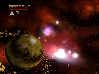 A large yellowish-brown planetoid dominates the left side of the screen against a dark starfield. Bright pink and white explosive effects burst in the center and upper-right, with smaller yellow asteroids scattered throughout the scene. A small score or status indicator reading "A" appears in the upper-left corner. The background shows a deep red and orange nebula-like gradient, creating a 3D space environment typical of 1990s 3D rendering.