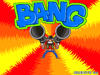 A bright, colorful title screen featuring the word "BANG!" in large blue letters with yellow outline at the top center. Below the title stands a cartoonish robot character wearing red and blue armor with two large black dome-shaped heads or speakers on its shoulders. The robot is centered against a vibrant background of red, yellow, and orange radiating lines creating a starburst effect. The overall art style uses bold, saturated colors typical of late-1990s arcade games with chunky pixel-based sprite graphics.