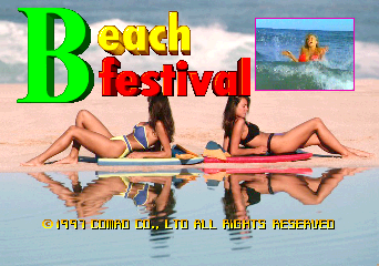 The title screen displays "Beach Festival" in large green and red letters at the top center. Below the text, two women in bikinis sit on colorful surfboards positioned on wet sand, their reflections visible in the water. A small inset image in the upper right shows a surfer on a wave. The background features a beach shoreline with cloudy sky. Copyright text reading "© 1997 COMAD CO.LTD ALL RIGHTS RESERVED" appears in yellow at the bottom of the screen.