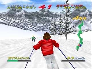 A skier in a red jacket and white pants descends a snowy mountain slope, viewed from behind. Pine trees dot the white landscape, with rocky mountain peaks visible in the distant background. The HUD displays stamina and speed meters on the left and right sides respectively. Yellow text reading "TOTAL TIME" and "RACE" appears at the top, with "STAMINA" visible in green on the lower left. The 3D graphics use the characteristic low-polygon style of N64 games, with a bright sky and flat snow terrain in the foreground.