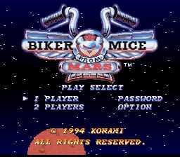 The title screen displays a large chrome-styled logo at the top featuring two ornate motorcycle exhaust pipes flanking the text 'BIKER MICE' with a central emblem. Below are menu options reading 'PLAY SELECT', '1 PLAYER', '2 PLAYERS', 'PASSWORD', and 'OPTION' in white text. A starfield background in dark blue fills the upper portion. At the bottom, yellow text reads '1994 KONAMI' and 'ALL RIGHTS RESERVED.' The entire interface uses a pixel-art aesthetic typical of early-1990s SNES games.