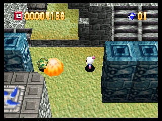 A top-down view of a grass and stone-tiled arena with a white Bomberman character standing to the right and an orange explosion effect in the center-left. Blue stone blocks and structures surround the perimeter. The UI displays a score of 10000158 in the upper-left corner, a gold coin counter showing 01 in the upper-right, and a life meter bar above it. The 3D isometric-style graphics show the character and environment rendered in low-polygon count typical of N64 hardware.