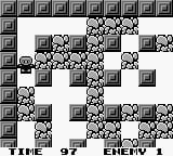 A Bomberman GB gameplay screen displays a grid-based maze level with gray stone borders and checkered floor tiles. The playable character appears as a small sprite near the center-left area. The level contains scattered destructible blocks in dark gray arranged throughout the playing field, creating a maze-like structure. Text at the bottom reads "TIME 97" on the left and "ENEMY 1" on the right, indicating remaining time and enemy count. The overall visual style uses monochromatic grays and blacks typical of Game Boy hardware, rendered in low-resolution pixels.