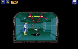 A top-down isometric view shows a character in blue and white standing on a teal-colored tiled floor in a room with dark teal walls and metallic framing. A red and yellow energy beam or laser weapon is visible at the top center of the screen, pointing downward. The character appears to be in combat or an interactive scenario. The graphics use low-resolution pixels typical of early 1990s DOS games, with a limited color palette of greens, teals, reds, and yellows. A UI panel with navigation elements appears in the top-left corner.