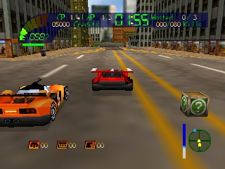 Three vehicles drive on a wide urban street with yellow center lines and tall buildings lining both sides. An orange car appears on the left, a red sports car in the center, and a green vehicle on the right. A circular minimap with compass is visible in the lower-right corner. The HUD displays fuel, health, and weapon icons across the bottom of the screen. The perspective is from directly behind the player's vehicle in a third-person racing view.