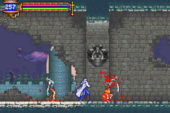 A side-scrolling castle interior displays a player character in blue clothing on the left side of the screen, facing three red-armored enemies positioned in the center and right. Stone brick walls form the backdrop, with purple atmospheric effects and torches visible. A blue health bar and stats panel appear at the top left corner. The sprite-based graphics use a 16-bit color palette typical of Game Boy Advance titles. A teal-colored floor platform runs horizontally across the lower portion of the screen.