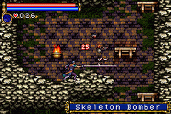 A sprite-based character wielding a whip stands in a brick chamber with stone walls and torches casting orange light. A blue health bar and status display occupy the top-left corner, while "SKELETON BOMBER" appears in a blue banner at the bottom. The isometric-style dungeon room contains wooden crates, barrels, and architectural details rendered in 16-bit pixel art with brown, gray, and cream tones.