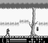 A monochrome Game Boy screenshot shows a sprite character standing on a wooden platform in the center, facing a tall bare tree with hanging objects. The background displays two layers of pixelated forest treelines creating depth through parallax. A stone ledge with regular notches forms the foreground platform. The HUD at the bottom displays a life bar, item inventory slots, and numerical indicators in the traditional Game Boy dot-matrix style. The overall palette uses black, white, and gray tones typical of original Game Boy hardware.
