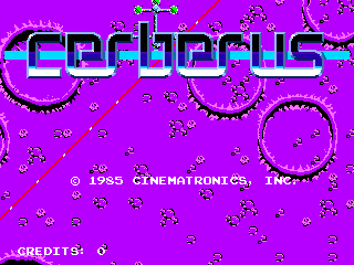 The title screen displays 'CERBERUS' in large cyan and magenta pixelated letters centered at the top of a bright magenta background. Below the title, small white pixel-art enemies and projectiles are scattered across the screen. The copyright text '© 1984 CINEMATRONICS, INC.' appears in the lower-left portion, with 'CREDITS: 0' displayed in the bottom-left corner. The overall color palette consists of bright magenta, cyan, white, and black, typical of mid-1980s arcade graphics with low-resolution sprite work.