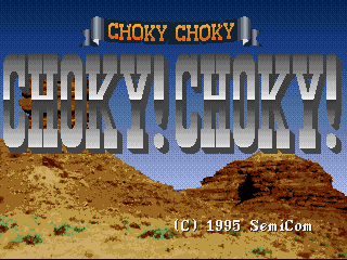 The title screen displays 'CHOKY CHOKY' in large orange and white letters at the top, with a duplicate gray shadow text below. The background shows a desert landscape with two brown rocky buttes against a blue sky and sand terrain. A copyright notice reads '(C) 1995 SemiCom' in the lower right corner. The overall color palette uses earthy browns and tans for the terrain with contrasting blue sky.