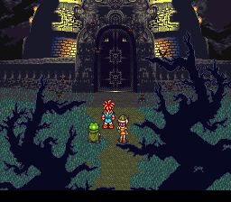 A party of four pixel-art characters stands in the center of a dark forest clearing surrounded by twisted black tree silhouettes. A large ornate castle structure with golden-lit windows and architectural detail dominates the background. The foreground shows green grass terrain with the characters positioned centrally, while the color palette uses purples, greens, golds, and blacks. The perspective suggests an overhead or isometric view typical of SNES-era RPG gameplay.