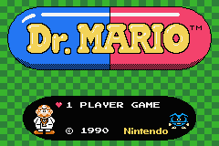 The Dr. Mario title logo dominates the center, rendered in blue and red pill-shaped segments with yellow text. Below sits a small pixel-art sprite of Dr. Mario in his white coat on the left side. The text "1 PLAYER GAME" appears in white beneath, with a copyright notice "© 1990 Nintendo" at the bottom. The background is a green checkered pattern typical of NES-era graphics, and the overall image maintains the blocky, low-resolution sprite style characteristic of early Game Boy Advance ports.