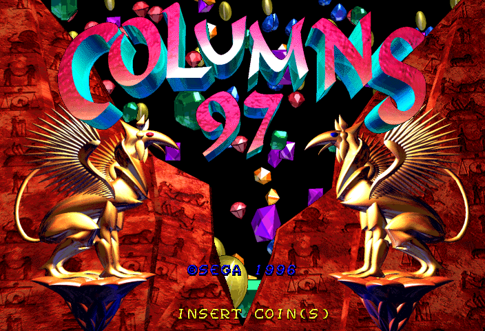 The Columns 97 title screen displays the game's logo in large magenta and cyan gradient letters at the top center, with "97" below in matching colors. Colorful gemstones and geometric shapes float across a black background between the logo and gameplay elements. Two golden winged lion statues flank the screen symmetrically on a red brick texture background. At the bottom, a coin counter reads "0$3.34 - 998" in blue text, with white text below stating "INSERT COIN(S)". The overall art style uses bright neon colors against dark backgrounds with 3D rendered decorative elements.