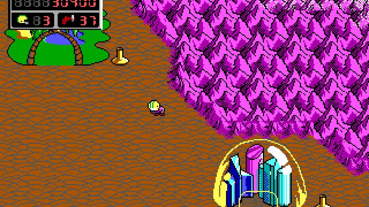 A side-scrolling platformer scene displays Commander Keen, a small yellow-hatted character, navigating a brown textured ground. At the top left, a green dome structure with blue interior and a yellow item sprite sits near the HUD showing score and lives. To the right, a large magenta crystalline formation fills the upper portion. Below, a yellow-bordered circular gateway containing cyan and purple vertical architectural elements serves as an interactive level entrance. The color palette uses brown, green, magenta, yellow, and cyan in pixel-art style typical of early 1990s DOS games.