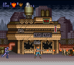 A side-scrolling action scene displays a heavily armored blue-suited protagonist centered on screen, facing a large golden mechanical structure with a skull emblem on its central door. The industrial building spans the full width of the scene against a dark urban skyline with tall buildings silhouetted in the background. Red enemy soldiers stand on platforms to the left and right. The HUD shows 'LP 300' in the upper left and displays '1UP' with health indicators at the top. The color palette emphasizes gold and brown tones for the fortress structure against the dark night sky, rendered in 16-bit sprite graphics with visible scanline pixelation.