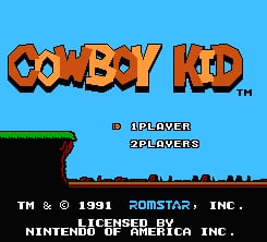 The Cowboy Kid title screen displays the game logo in large orange pixelated lettering against a bright blue sky background. Below the title, "1 PLAYER" and "2 PLAYERS" options appear in white text. A green horizontal platform spans the lower portion of the screen, with black ground and distant horizon silhouettes. Copyright text for Romstar Inc. and Nintendo licensed by Jaleco Inc. appears at the bottom in small white text, dated 1991.