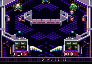A pinball table viewed from above displays a symmetrical layout with two flippers at the bottom corners, bumpers and ramps in the center, and decorative rock-themed graphics flanking both sides. The playfield uses a dark blue hexagonal pattern background with purple and cyan neon-style borders framing the table edges. A score readout showing numerals appears at the bottom center of the screen. The sprite-based graphics feature 16-bit color depth typical of Sega Genesis hardware, with metallic silver ramp structures and illuminated target indicators scattered across the playing surface.