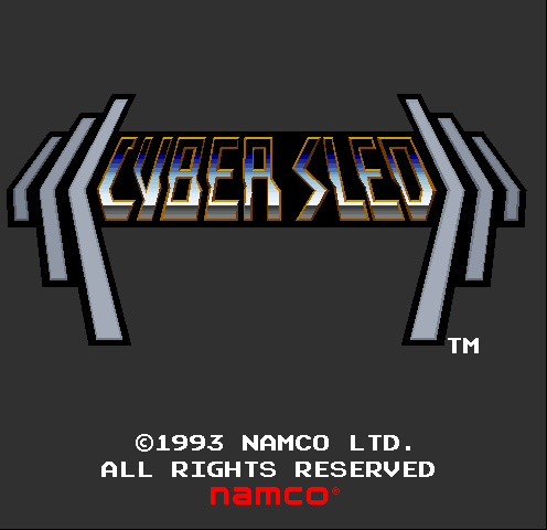The Cyber Sled arcade title screen features a large pixelated logo in orange and blue lettering centered against a dark gray background, flanked by white geometric mechanical arms or brackets extending left and right. Below the title, copyright text reads "©1993 NAMCO LTD. ALL RIGHTS RESERVED" in white pixels, with the Namco logo in red at the bottom. A trademark symbol appears in the upper right corner.