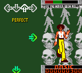 A Game Boy Color screenshot displaying a dance rhythm game interface with a green background. At the top left, a score counter reads "PERFECT" in yellow text. The center shows a dancing character in red and white clothing striking a pose. Behind the character stands a row of white skull sprites arranged vertically. The top right corner displays the game's logo with stylized text. At the bottom, a red platform or stage area is visible. The overall color palette consists of green, white, red, and yellow pixels typical of Game Boy Color graphics.