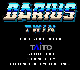 The title screen displays "DARIUS TWIN" in large cyan and white pixelated letters at the top center, with a 3D beveled effect. Below the title sits "PUSH START BUTTON" in white text. The Taito logo appears in purple lettering, followed by copyright information reading "@TAITO 1991" and "LICENSED BY NINTENDO OF AMERICA INC." in smaller white text at the bottom. The background is solid black, creating high contrast with the colorful text elements.
