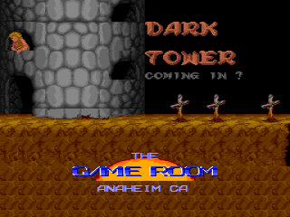 The title screen displays 'DARK TOWER' in large orange pixelated text against a dark gray stone wall background. Below the title, white text reads 'COMING IN 7'. A small brown sprite character stands on an orange-brown ground platform, with three white crosses visible to the right. At the bottom of the screen, a blue rectangle contains white text reading 'AMUSEMENT / ANAHEIM CA'. The overall visual style uses a limited color palette typical of early 1990s arcade graphics with low-resolution sprites and parallax-style background.