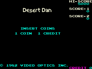 A black arcade title screen displays 'Desert Dan' in white text centered near the top. The upper right corner shows a score panel with 'HI-SCORE' and three score entries labeled 1, 2, and 3 in cyan text. Below the title, cyan text reads 'INSERT COINS' followed by '1 COIN 1 CREDIT'. At the bottom, a copyright notice in cyan states '© 1982 VIDEO OPTICS INC.' with 'CREDIT' in magenta text to the right. The overall design uses a simple cyan and magenta color scheme against a black background typical of early 1980s arcade cabinets.