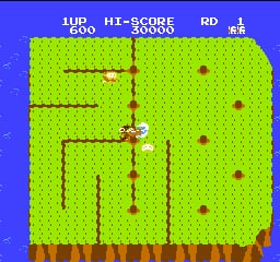 A yellow pixelated character stands in the center of a bright lime-green maze filled with brown tunnel walls. The top UI displays "1UP 600", "HI-SCORE 30000", and "RD 1" with a small kanji symbol. Red spherical enemies are scattered throughout the maze at various positions. The bottom of the screen shows a brown rocky terrain layer. The overall color palette uses bright primary colors typical of NES-era graphics with low sprite resolution.