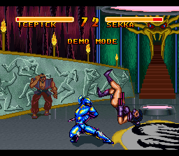 A blue-clad fighter in a martial arts stance occupies the center of the screen, facing two opponents on a gray stone floor. The left side shows a reddish character, while the right displays a shirtless fighter in yellow. The background features ornate red curtains and decorative wall patterns in green and gold tones. Neon-colored UI elements frame the top of the screen, with yellow text displaying health or score information. The art style uses 16-bit sprite graphics typical of early 1990s console fighting games.