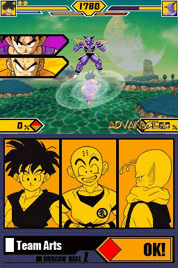 A battle screen from Dragon Ball Z: Supersonic Warriors 2 displays two characters mid-combat on a grassy landscape with mountains and water in the background. The upper portion shows character portraits and health bars with a yellow frame containing two fighter avatars. The lower section features a three-panel character select or status display with yellow-bordered cells showing character artwork in profile and facing views. A "Team Arts" label and "OK" button appear at the bottom left, with what appears to be a power level or score reading "1700" in the top-right corner. The interface uses a bright yellow and black color scheme typical of 2005-era Nintendo DS fighting games.