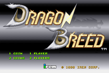 The arcade title screen displays "Dragon Breed" in large gold and silver gradient lettering across the upper half against a dark gray diagonal striped background. Below the title, green text lists coin and player options: "1 COIN 1 PLAYER" and "2 COINS 2 PLAYERS" aligned to the left. The bottom of the screen shows the Irem copyright mark and "© 1989 IREM CORP." in yellow and white text. The overall aesthetic uses a low-resolution pixelated sprite style typical of late-1980s arcade graphics.