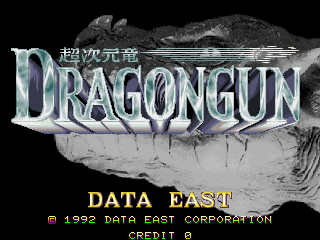 The title screen displays 'DRAGONGUN' in large metallic lettering with a dragon illustration wrapped around the text against a black background. Below the title, yellow text reads 'DATA EAST' followed by 'CREDIT 0' in a smaller font. The overall composition uses a monochromatic grayscale palette typical of early 1990s arcade graphics, with the dragon artwork rendered in shades of gray against the dark background.
