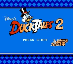 The title screen displays 'DuckTales 2' in large red letters with Disney branding in the upper left. Uncle Scrooge McDuck appears as a sprite character wearing his top hat in the center-left area. A blue background fills the screen with a diamond-pattern border at the top and bottom in darker blue. 'PRESS START' text appears in white below the title. A small 'CAPCOM' logo sits in the bottom right corner. The overall design uses 8-bit pixel art style typical of NES games.