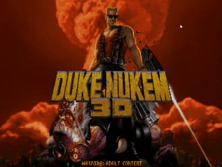 The Duke Nukem 3D title screen displays the large gold logo text centered on the image, with a muscular protagonist character standing in the middle wearing combat gear against a fiery orange-red background with flames. Below the character are smaller action scenes showing combat encounters. At the bottom of the screen, white text reads 'MISSING: ADULT CONTENT'. The overall color palette consists of warm orange, red, and yellow tones dominating the composition.
