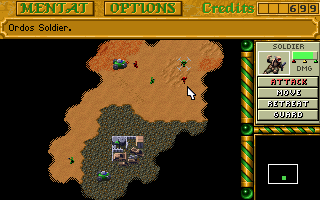 A brown and dark-green isometric terrain map displays scattered buildings and structures across a desert landscape. The top menu bar contains yellow buttons labeled MENU, OPTIONS, and CREDITS. A right-side panel shows unit selection icons including a soldier, vehicle, and house, with buttons for REPAIR, MOVE, ATTACK, and GUARD below. The minimap in the bottom-right corner shows the current viewport. A cursor arrow points to the playfield, indicating interactive elements. The DOS-era graphics use a limited color palette with pixelated sprites typical of early 1990s real-time strategy games.