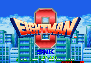 The title screen features a large red and gold shield-shaped logo with "EIGHT MAN" in bold yellow lettering across the center, flanked by blue vertical bars. Below the logo sits the SNK publisher mark. The background shows a bright blue sky with white clouds and a cityscape of tall blue and cyan buildings with rectangular windows. The overall color palette is dominated by blues, reds, and yellows typical of early 1990s arcade graphics.