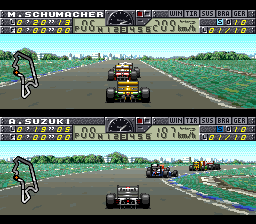 Two split-screen SNES racing views display Formula 1 cars on asphalt tracks with green grass verges and spectator barriers. The top screen shows a red and yellow race car ahead on a straight section with trees and grandstands visible in the background. The bottom screen depicts a black race car on a similar track segment with blue barrier markings and a distant landscape. Both screens feature status information and UI elements along the top edges. The graphics use 16-bit sprite-based rendering with parallax scrolling landscape elements.