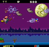 A horizontal shooter gameplay scene displays a yellow sprite character in the center-left firing projectiles toward green enemy ships scattered across a starfield. The top HUD shows score, lives counter reading two, and the number 900. A large yellow moon appears in the upper-right background. A dark silhouetted landscape with tree shapes forms the bottom boundary. The color palette uses purples, yellows, greens, and blacks typical of 16-bit sprite graphics. A blue status bar at the bottom shows additional game information and remaining health.
