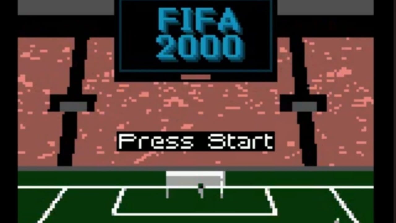 The FIFA 2000 title screen displays blue text at the top against a black background. Below sits a pixelated stadium structure with terracotta-colored walls and dark pillars flanking a central area. A white "Press Start" instruction appears in the middle section. At the bottom, a green soccer field with white boundary lines and a goal net is visible. The overall scene uses low-resolution 8-bit graphics typical of Game Boy hardware.