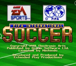 The FIFA International Soccer title screen features the EA Sports and FIFA logos at the top, with 'FIFA INTERNATIONAL' text on a blue banner. Large green-and-yellow pixelated letters spell 'SOCCER' as the central title. Below is copyright information for Electronic Arts and Nintendo, along with development credits listing Extended Play Productions. A green gradient background fills the screen. The overall aesthetic uses the 16-bit sprite style characteristic of early 1990s SNES titles.