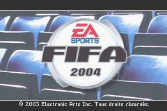 The FIFA Soccer 2004 title screen features a large circular white logo in the center displaying the EA Sports branding in red and blue, with "2004" below it. Behind the logo is a blurred background showing a blue stadium seating pattern. The screen has a dark gray border at top and bottom. A copyright notice reading "© 2005 Electronic Arts Inc. Two mode classics" appears in small white text at the bottom of the screen.