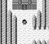 A Game Boy screen displays a top-down overworld view with a small protagonist character sprite standing in a snowy landscape. Pine trees rendered in monochrome pixels line both sides of the scene, creating vertical borders. A cabin or building structure appears at the top center of the screen. The terrain consists of simple white and gray pixels representing snow and ground. The art style reflects the Game Boy's 1-bit to 4-shade monochrome palette typical of early 1990s handheld RPGs.