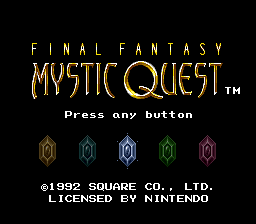 The title screen displays 'FINAL FANTASY' in gold text at the top, followed by 'MYSTIC QUEST' in larger ornamental gold lettering with a trademark symbol. Below that, white text reads 'Press any button'. Five colored gem or crystal icons are arranged horizontally across the center in blue, cyan, white, green, and magenta tones. At the bottom, white text indicates '©1992 SQUARE CO., LTD.' and 'LICENSED BY NINTENDO'. The background is solid black, and the overall design uses a 16-bit SNES color palette with pixel-based fonts typical of the era.