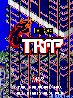 A red demon-like character with horns dominates the left side of the screen, positioned above the large white "TRAP" text with yellow outline. The title "FIRE" appears in yellow above it. The background shows an isometric grid of blue and orange building structures receding into the distance. Copyright text for Woodplace Inc. and Data East USA appears at the bottom, along with 1986 and arcade credit information. The overall color scheme uses bright blue, orange, red, yellow, and white against a deep blue background.