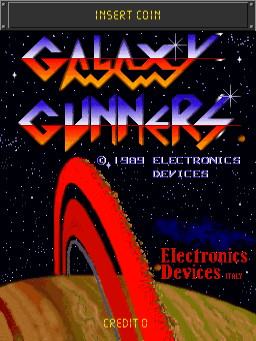 The arcade title screen displays "GALAXY GUNNERS" in large, bold orange and blue letters against a starfield background. Below the title, "© 1989 ELECTRONICS DEVICES" appears in white text. A red curved spacecraft graphic occupies the lower portion of the screen, rendered with a tan-colored surface detail. "Electronics Devices" is printed in red text on the right side, and "CREDIT 0" appears in red at the bottom left. An "INSERT COIN" prompt is visible at the top in yellow text. The overall aesthetic uses a dark space background with bright neon-style lettering typical of late-1980s arcade cabinet graphics.